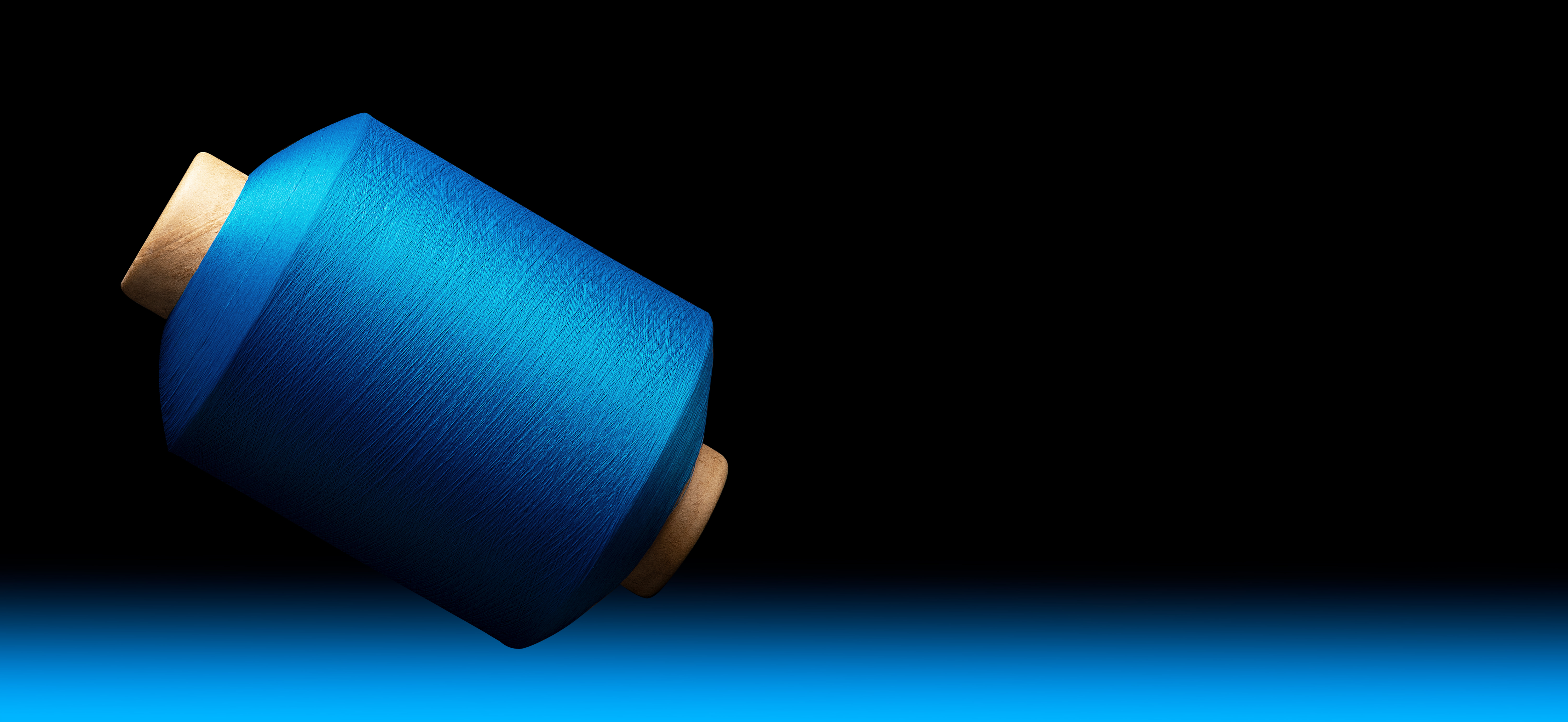 A vibrant display of yarn spools in Oaxaca, showcasing diverse colors and textures in a textile workshop.